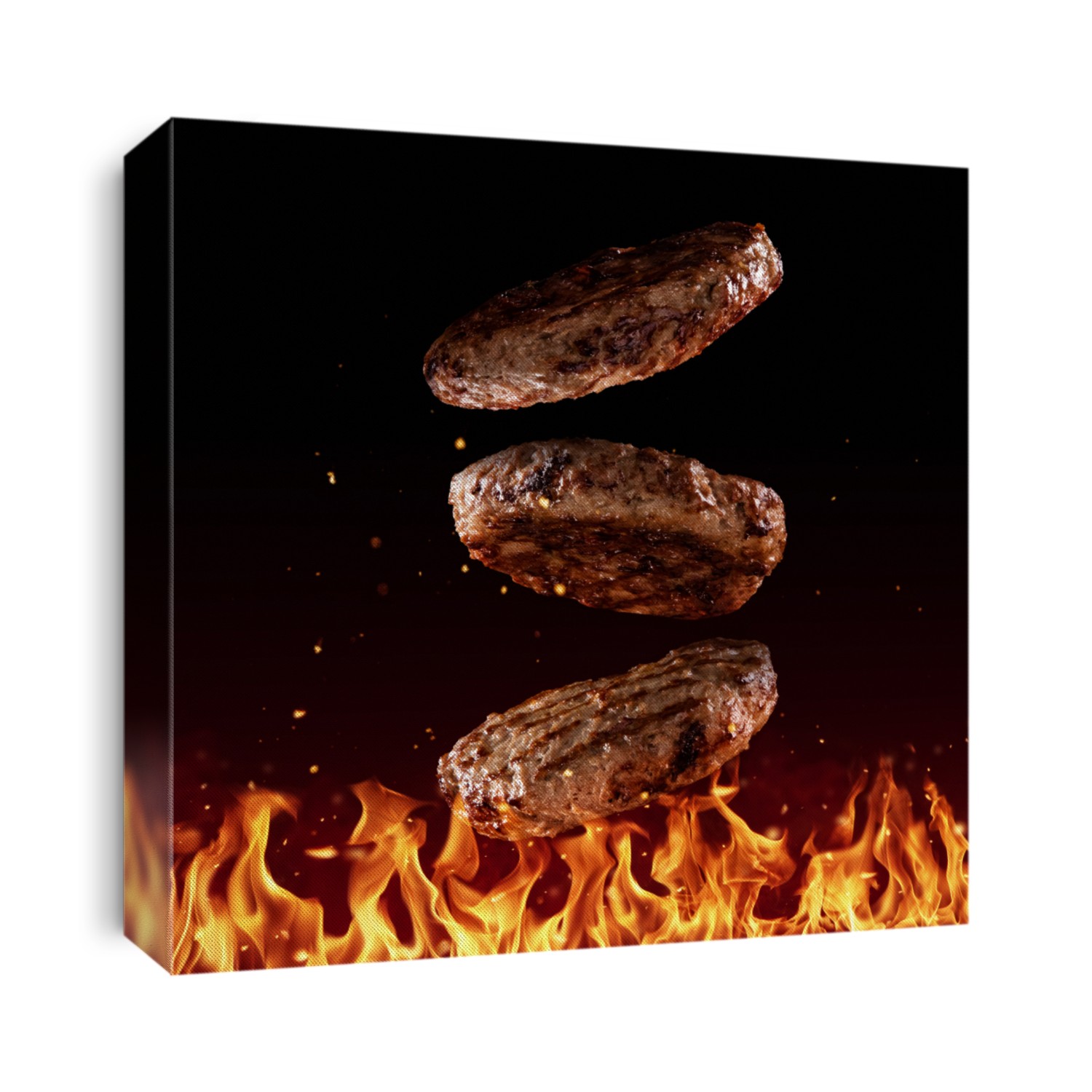 Flying beef minced hamburger pieces above grill flames, isolated on black background. Concept of flying food, very high resolution image