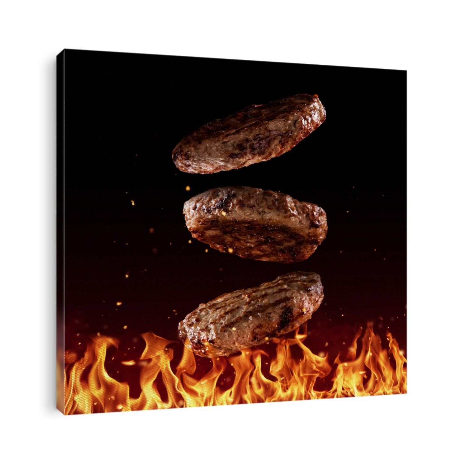 Flying beef minced hamburger pieces above grill flames, isolated on black background. Concept of flying food, very high resolution image